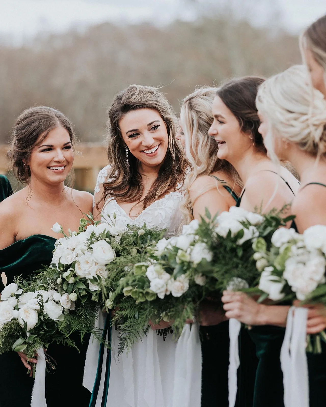 Bride and bridesmaids holding bouquets