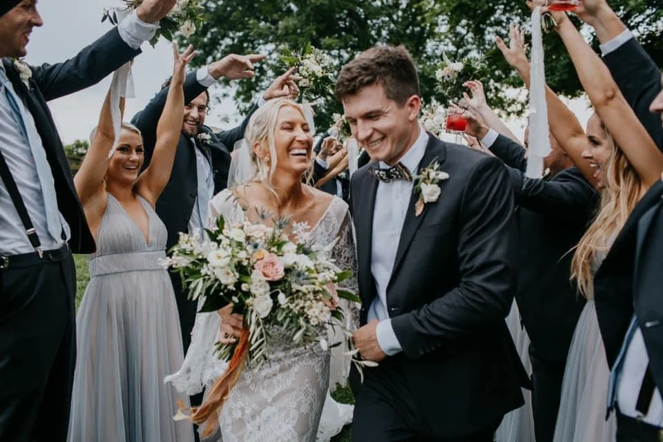 Newlywed couple celebrating with friends